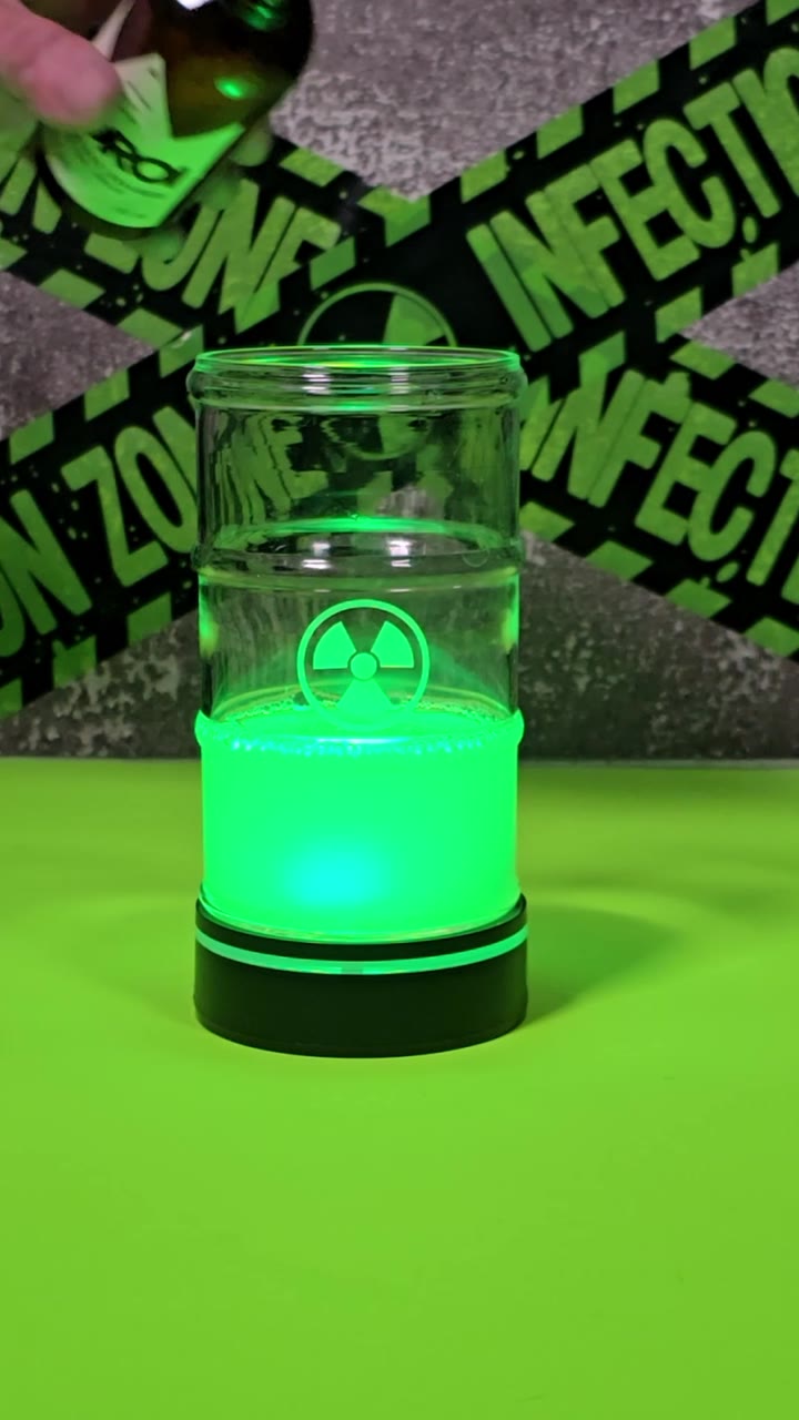 Bright green cocktail foam in a Halloween drinks video